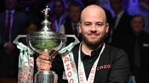 Luca Brecel wins his first world snooker title by holding off a late comeback from Mark Selby.