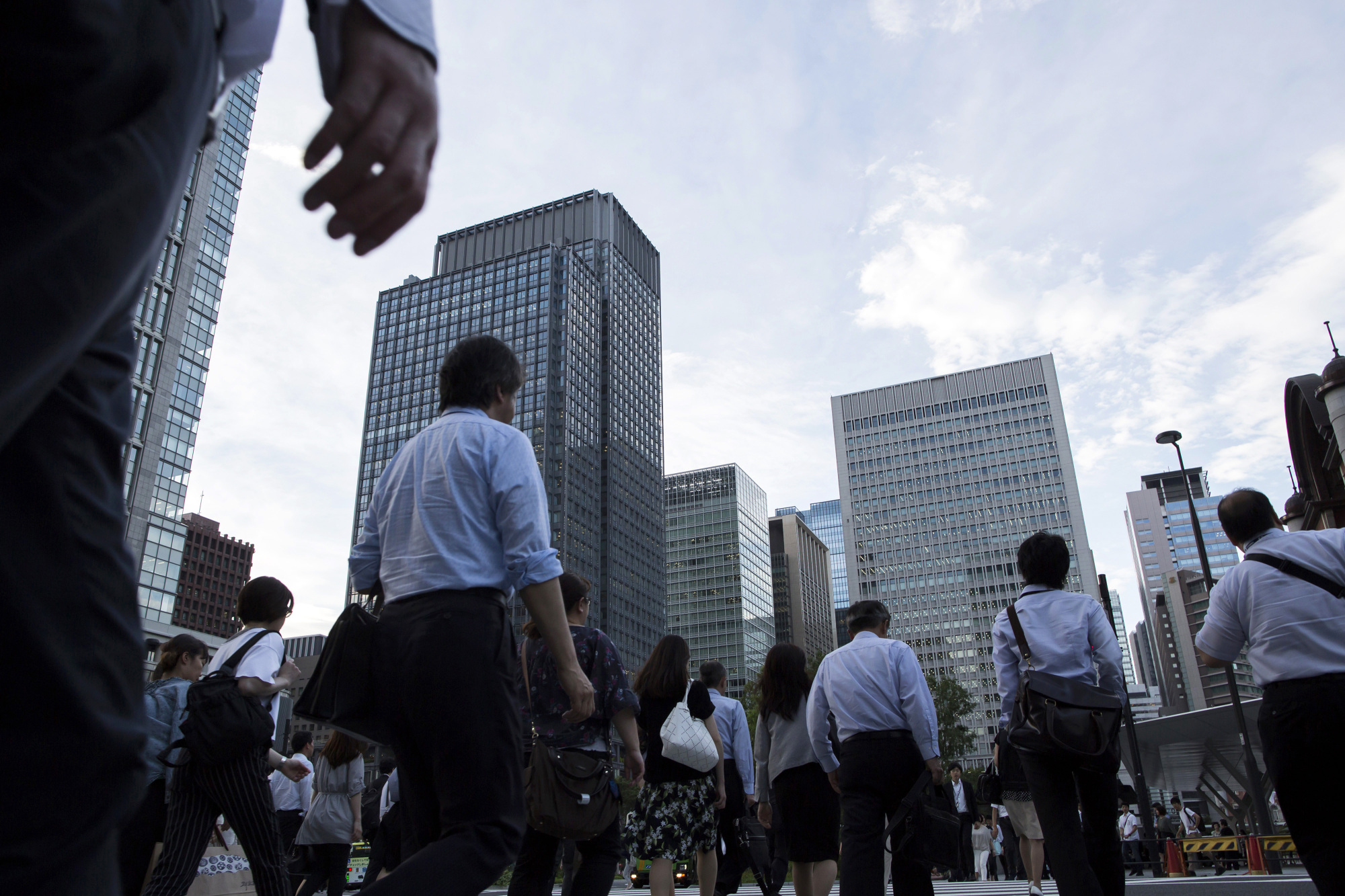 Japan escapes a technical recession as revised economic growth data.