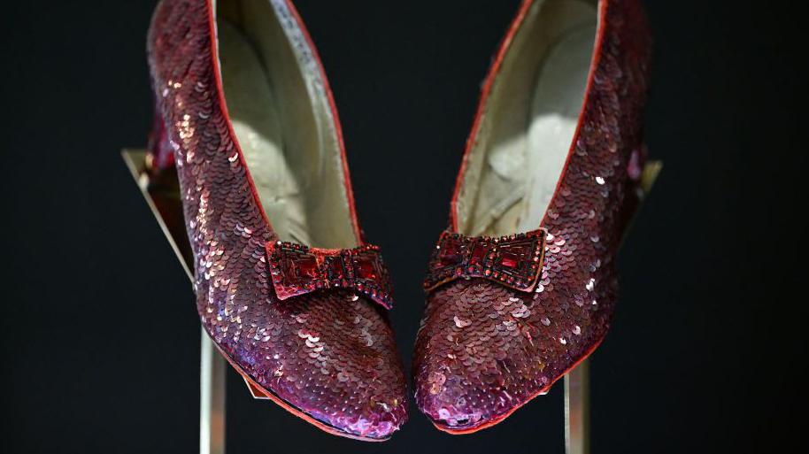 At auction, Dorothy’s ruby slippers bring $28 million.